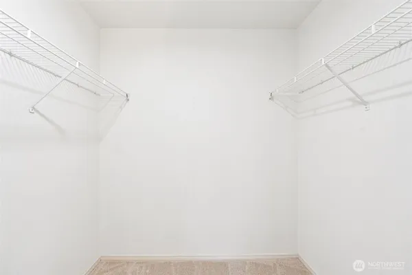 a bathroom with a granite countertop sink a mirror and shower