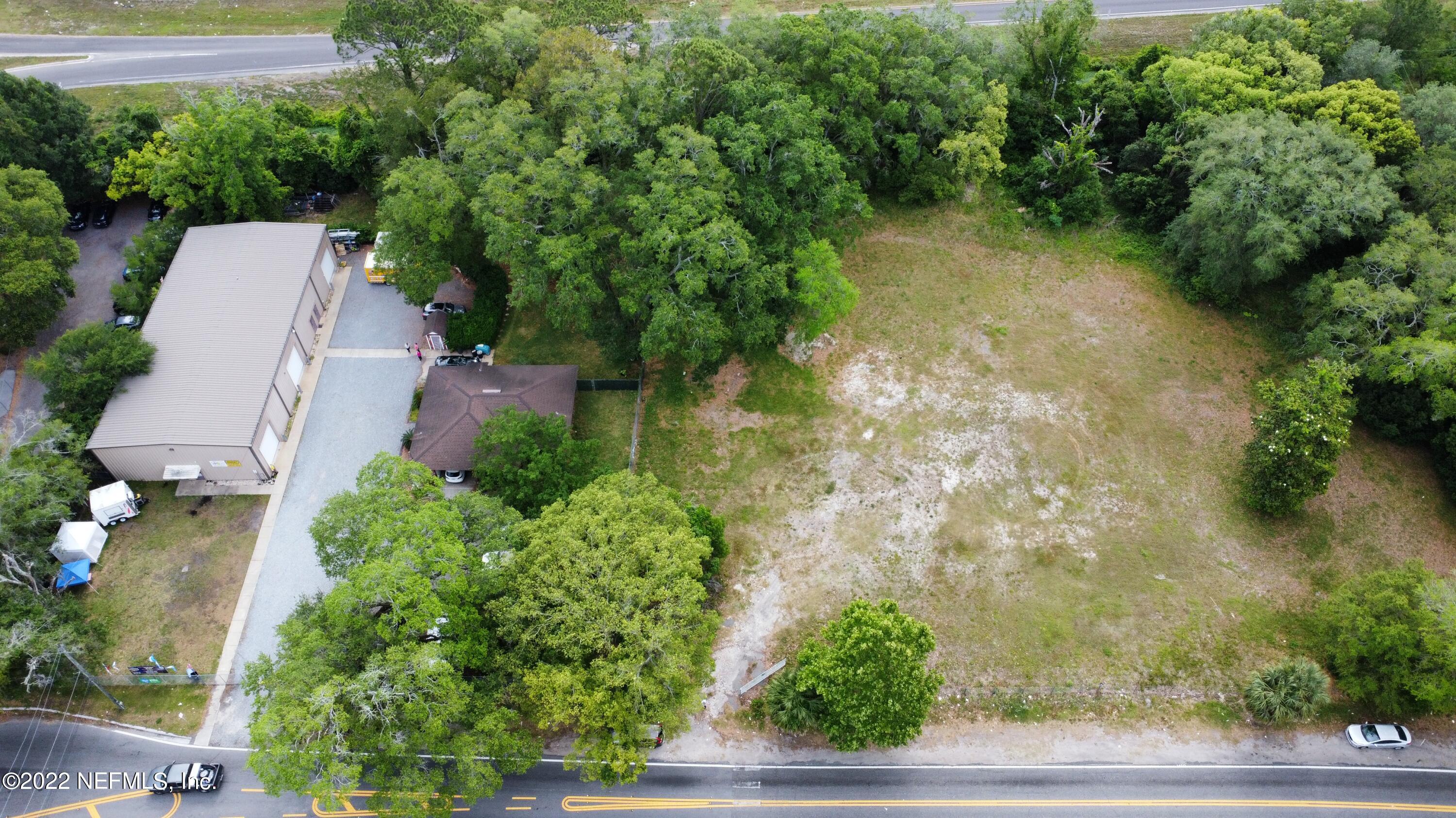 5517 Firestone Road Jacksonville, FL 32244 - Photo 4 of 4 an aerial view of a house with pool yard and outdoor seating