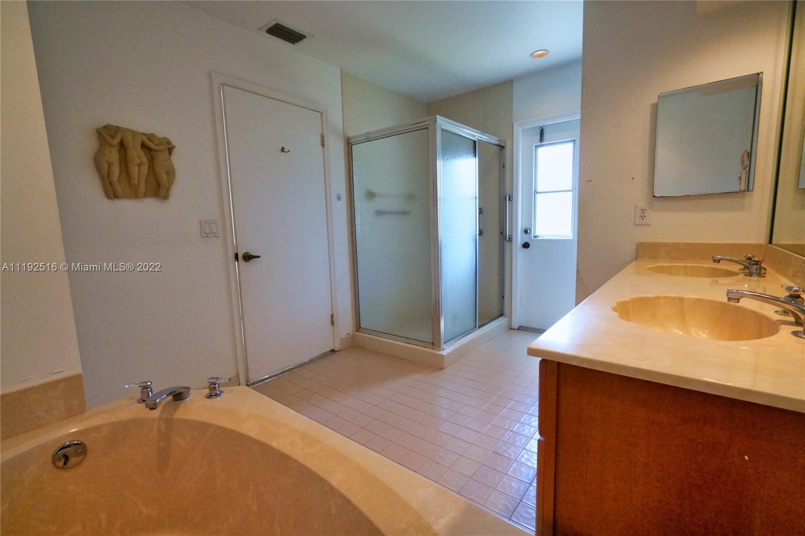 21291 Sawmill Court Boca Raton, FL 33498 - Photo 16 of 32 a bathroom with a sink and a mirror