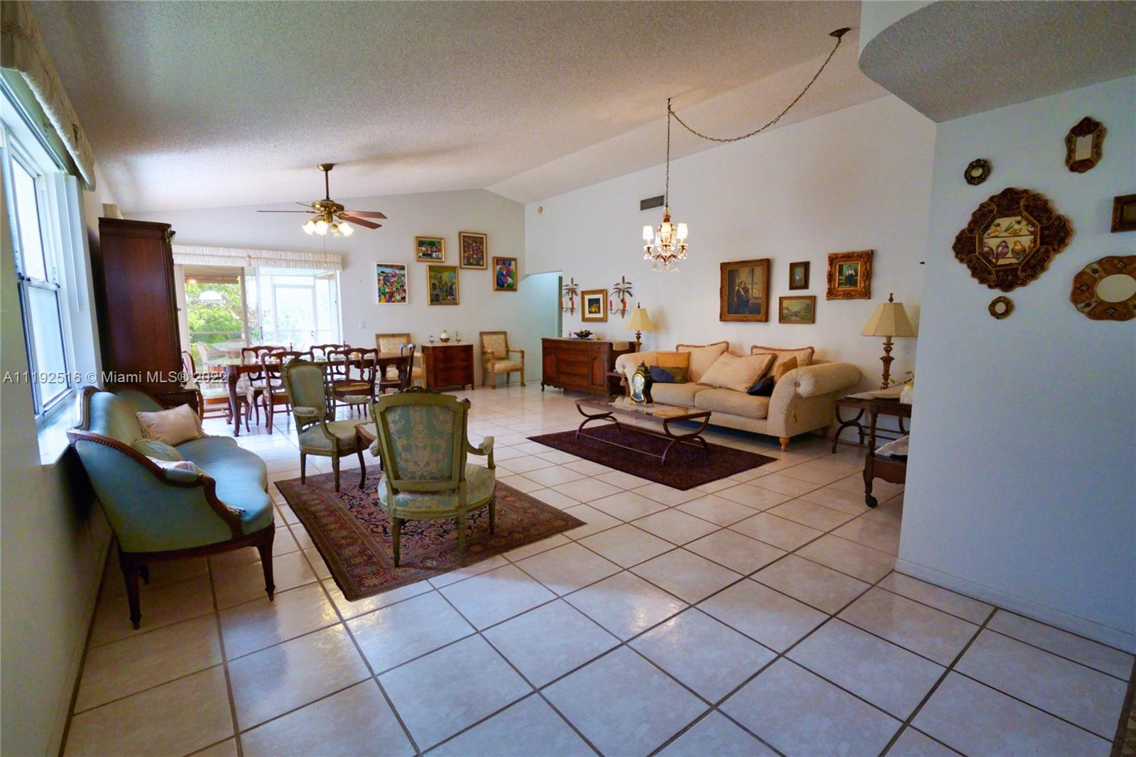 21291 Sawmill Court Boca Raton, FL 33498 - Photo 21 of 32 a living room with furniture and wooden floor