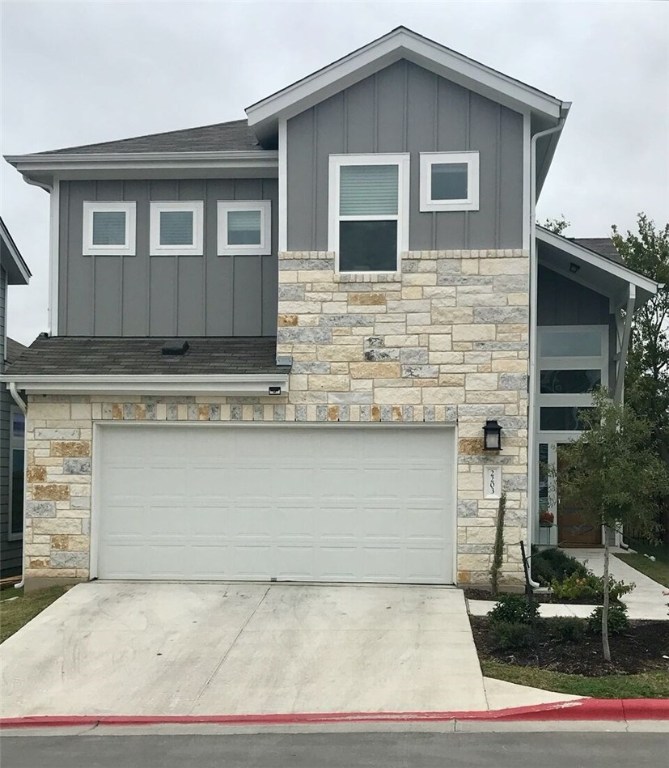 a front view of a house with garage