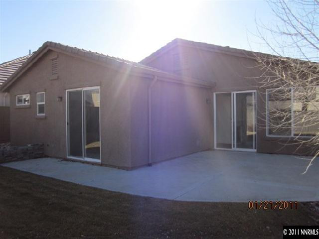 561 Beckfield Court Reno, NV 89521 - Photo 8 of 9 a front view of a house with a yard