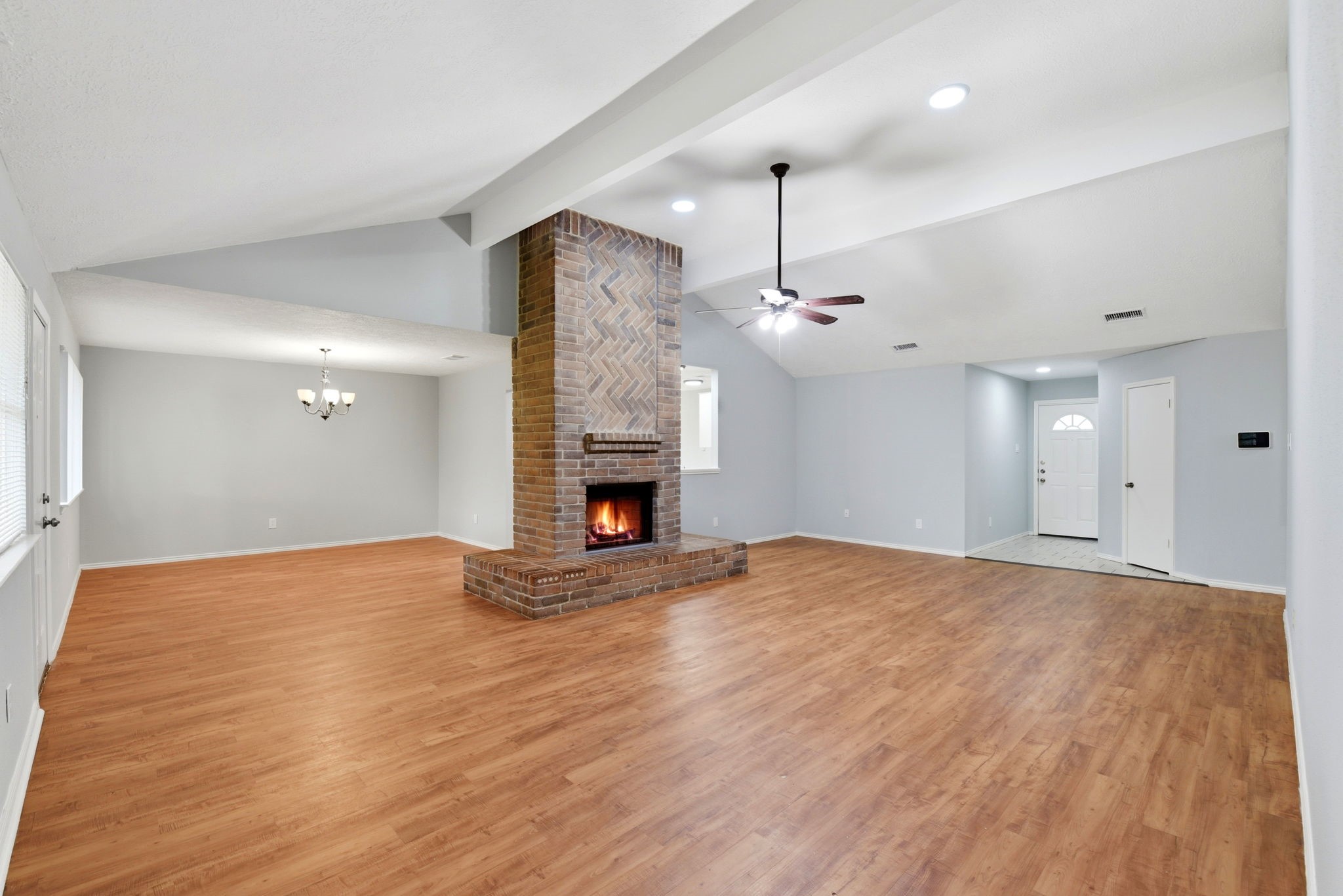 21330 Golden Dove Drive Spring, TX 77388 - Photo 7 of 29 The living area flows effortlessly into the dedicated dining room, ensuring you're never disconnected from the action.