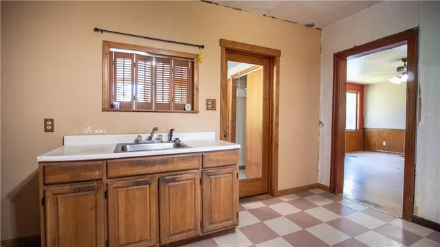 a bathroom with a sink a mirror and a shower