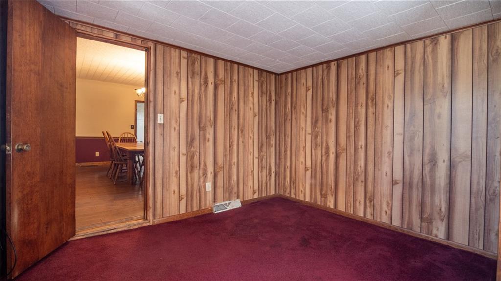 105 Snyder Lane Sarver, PA 16055 - Photo 30 of 48 an empty room with wooden floor and furniture