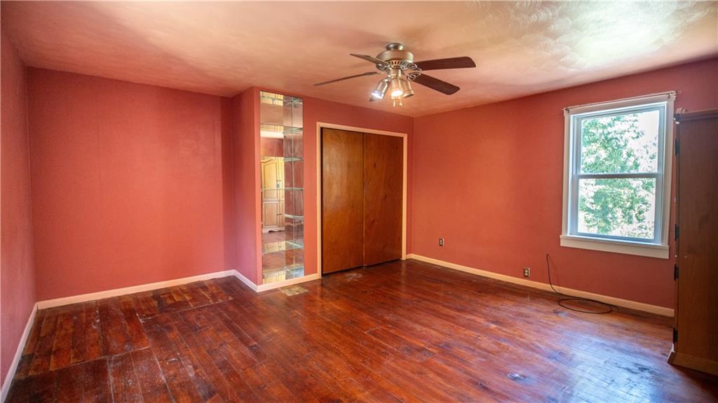 105 Snyder Lane Sarver, PA 16055 - Photo 35 of 48 a view of an empty room with a window and wooden floor