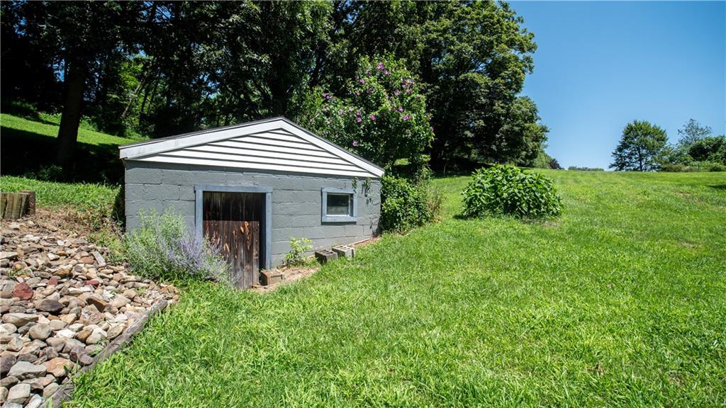 105 Snyder Lane Sarver, PA 16055 - Photo 40 of 48 a front view of a house with garden