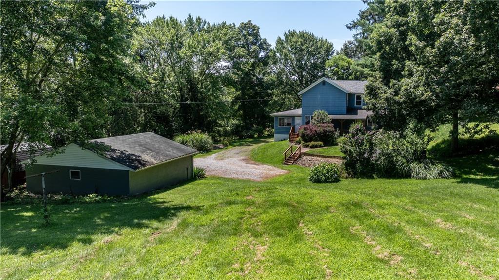 105 Snyder Lane Sarver, PA 16055 - Photo 4 of 48 a view of a house with backyard and sitting area