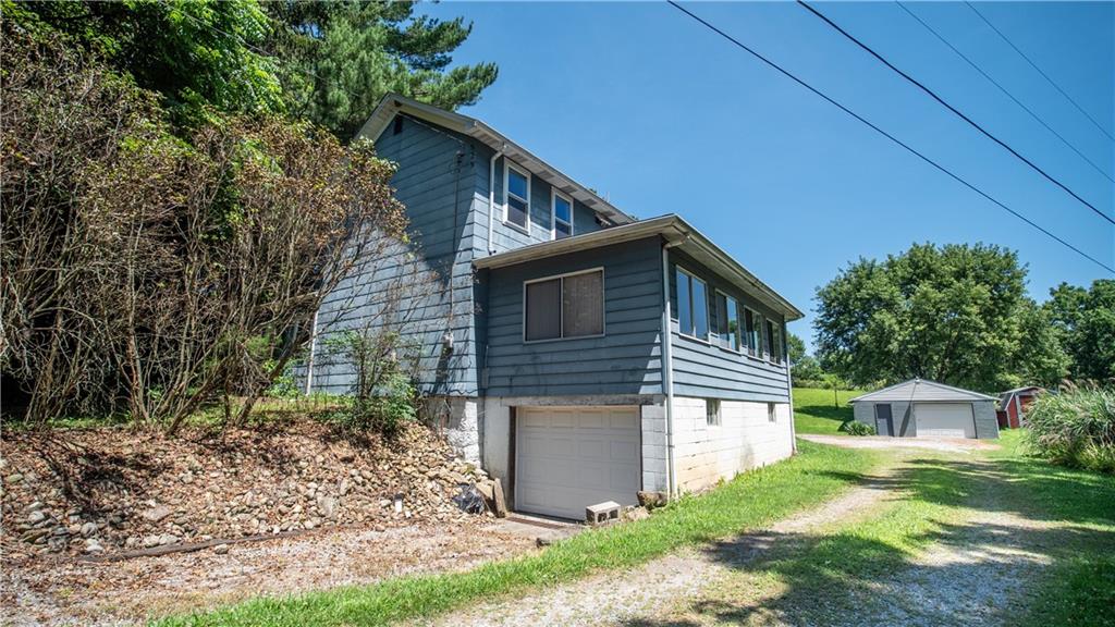 105 Snyder Lane Sarver, PA 16055 - Photo 47 of 48 a front view of a house with garden
