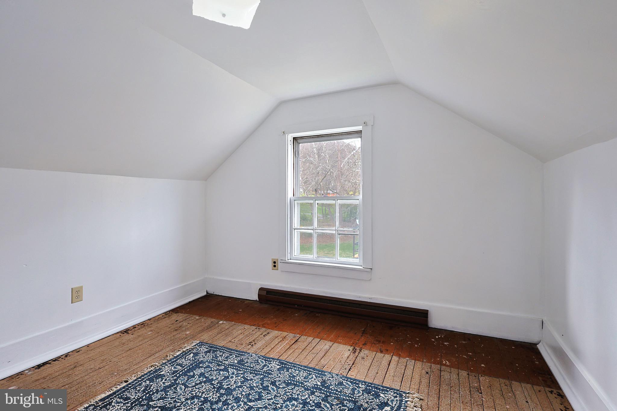 159 Rocket Center Road Keyser, WV 26726 - Photo 39 of 64 an empty room with wooden floor and windows