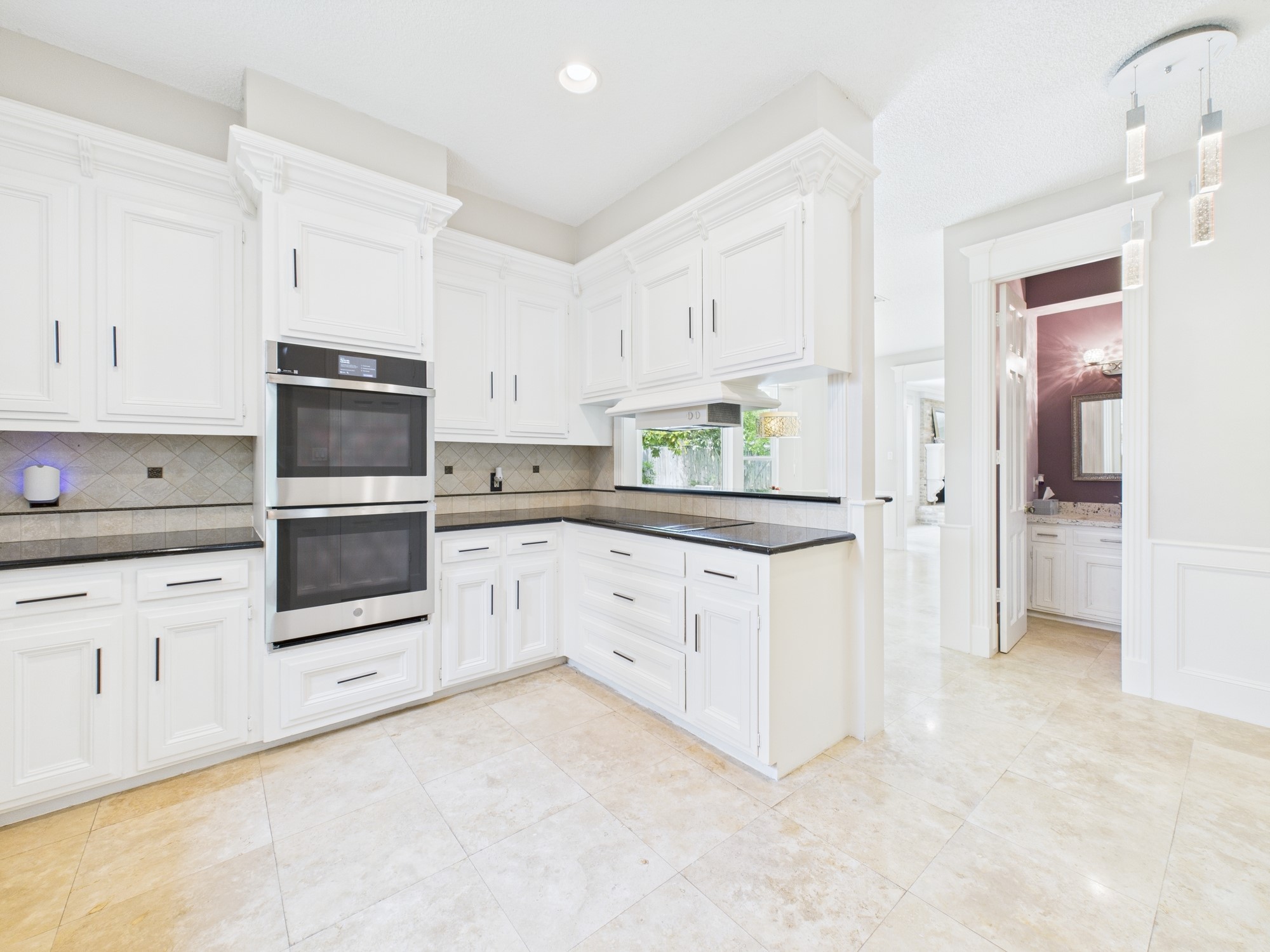 702 Daria Court Houston, TX 77079 - Photo 12 of 44 Off the Kitchen is a Beautiful Powder Room & Breakfast Room