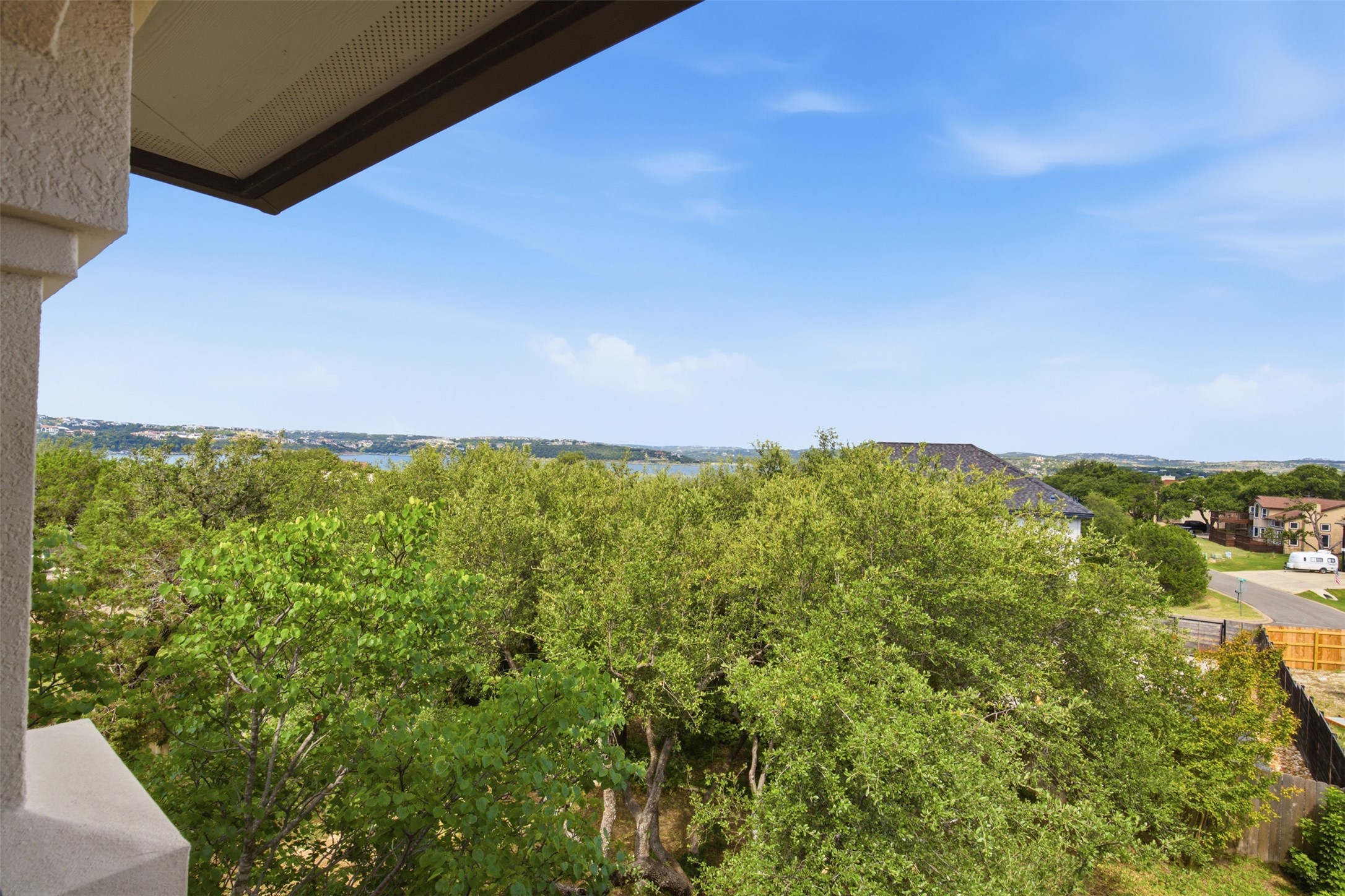700 Augusta Circle Point Venture, TX 78645 - Photo 21 of 35 A tranquil water view beyond lush treetops defines this scenic property.