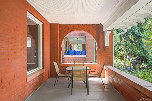 a dining room with furniture and a window