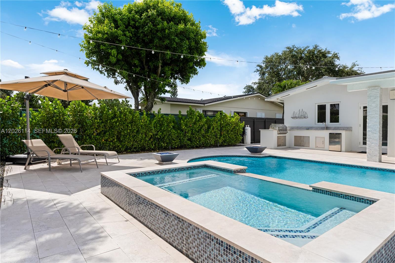 9641 Southwest 66th Street Miami, FL 33173 - Photo 45 of 57 a view of a house with swimming pool and sitting area