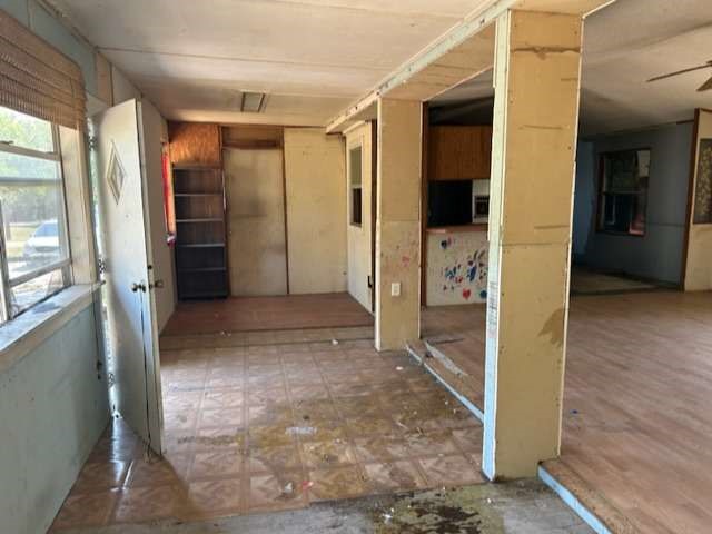 3702 Park Street Damon, TX 77430 - Photo 12 of 12 a view of a hallway with wooden shelves
