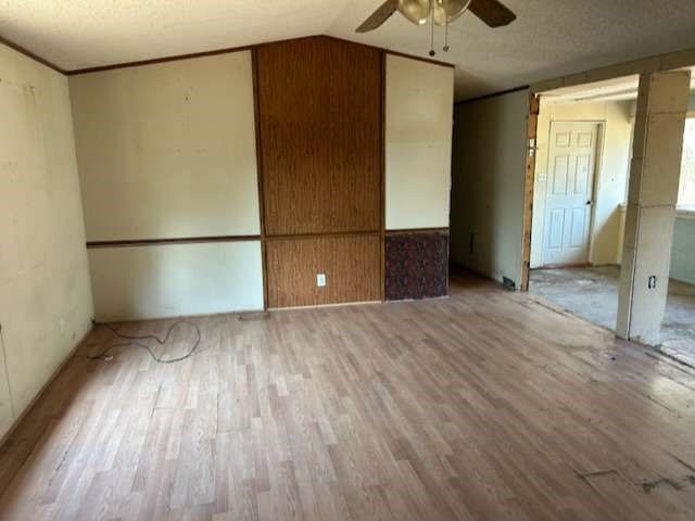 3702 Park Street Damon, TX 77430 - Photo 3 of 12 a view of empty room with wooden floor and fan
