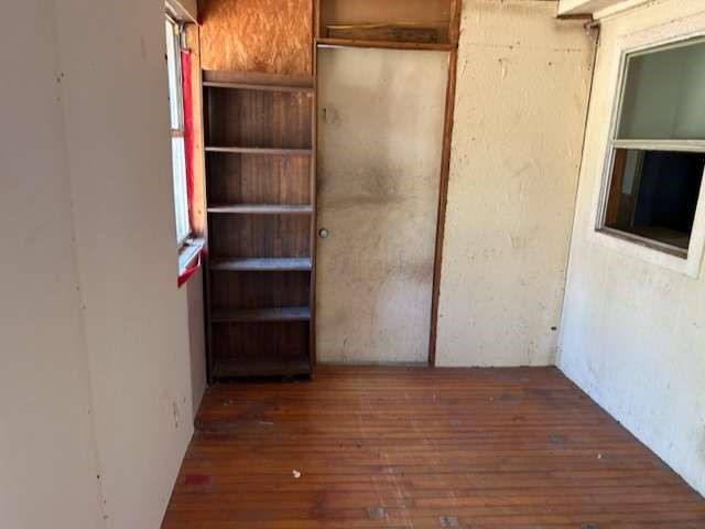 3702 Park Street Damon, TX 77430 - Photo 6 of 12 a view of walk in closet with empty racks