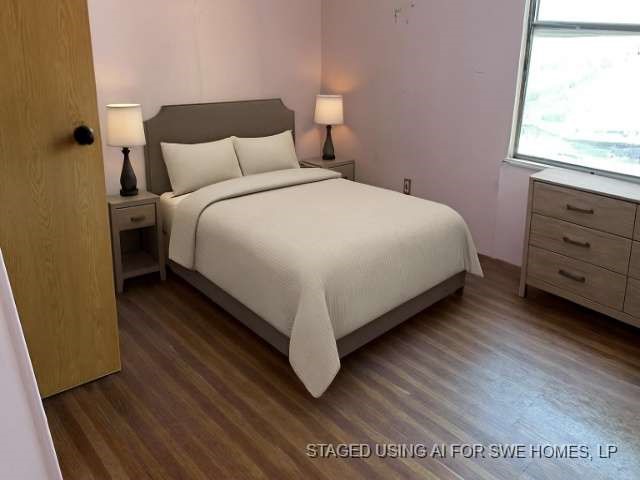 3702 Park Street Damon, TX 77430 - Photo 9 of 12 a large bed sitting in a bedroom next to a window