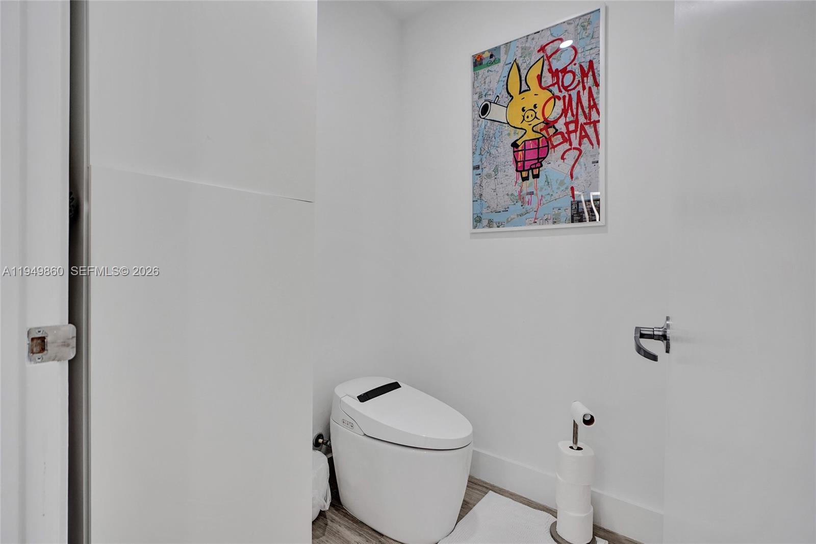 1100 Biscayne Boulevard, Unit 3708 Miami, FL 33132 - Photo 21 of 43 a white toilet sitting next to a white wall
