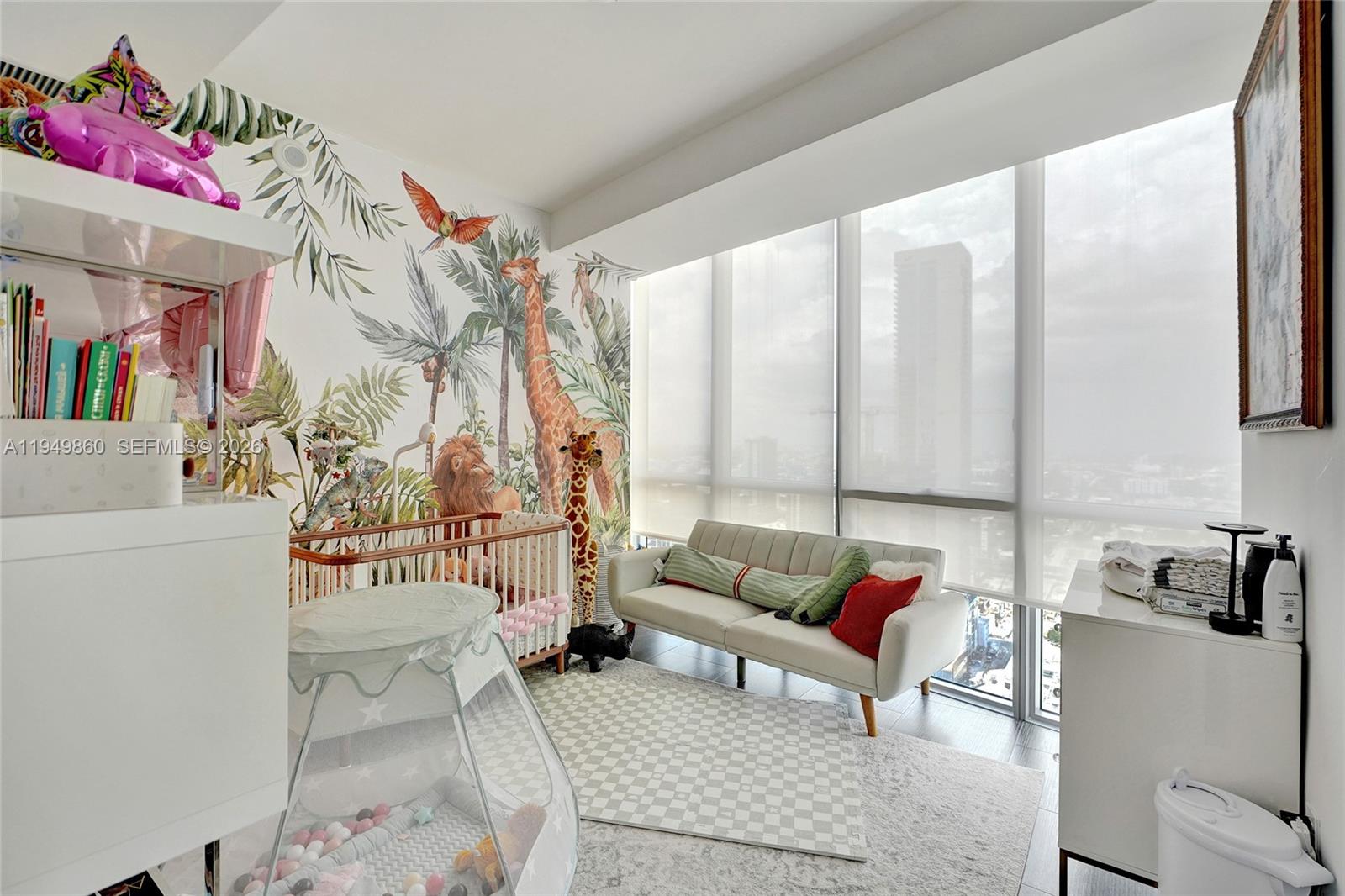 1100 Biscayne Boulevard, Unit 3708 Miami, FL 33132 - Photo 26 of 43 a living room with furniture and a painting on the wall