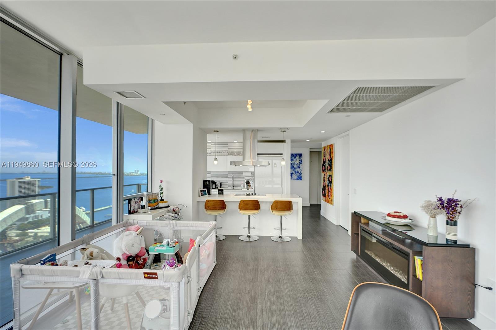 1100 Biscayne Boulevard, Unit 3708 Miami, FL 33132 - Photo 3 of 43 an entryway with furniture and wooden floor