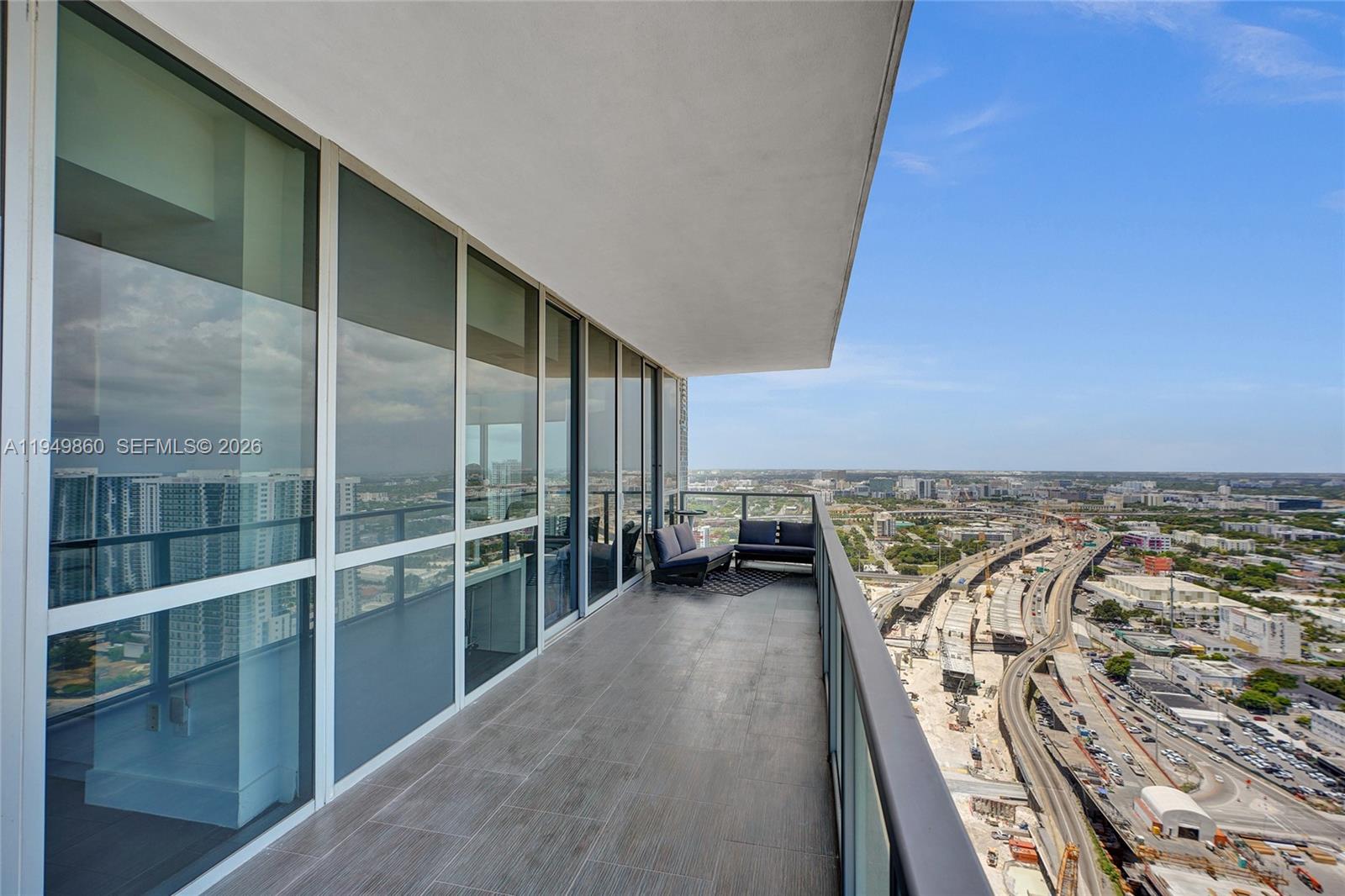1100 Biscayne Boulevard, Unit 3708 Miami, FL 33132 - Photo 32 of 43 an entrance view with glass door and stairs