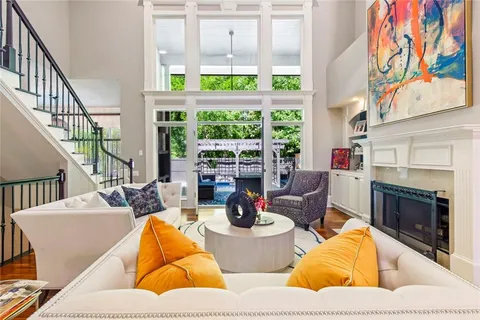 a view of a patio with table and chairs and couches