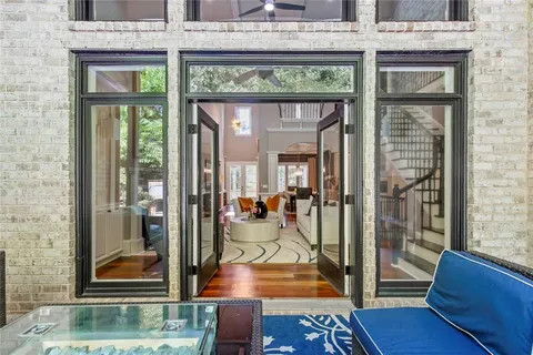 a view of a patio with two chairs and a table