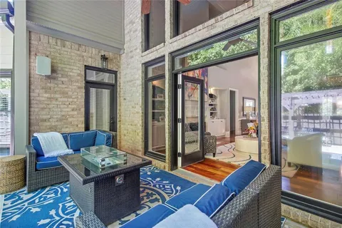 a kitchen with stainless steel appliances granite countertop a refrigerator a oven a sink dishwasher and white cabinets with wooden floor