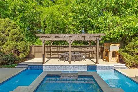 a kitchen with stainless steel appliances a refrigerator and cabinets