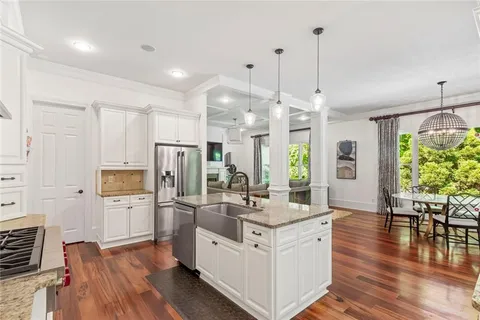 a living room with furniture cabinets and window