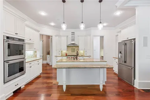 a living room with a bed and a fireplace