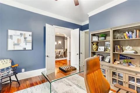 a bathroom with a granite countertop sink mirror vanity and toilet
