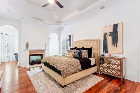 a bathroom with a granite countertop sink toilet mirror and shower