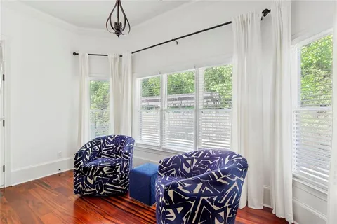 a workspace with furniture and a flat screen tv