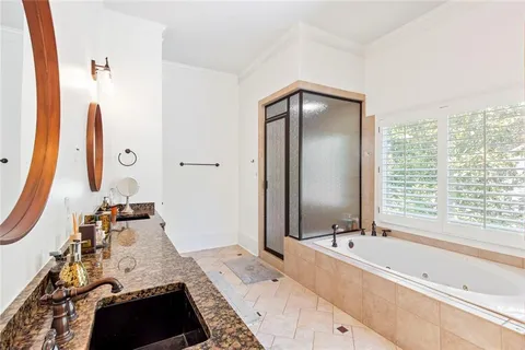 a media room with lots of chairs and a chandelier