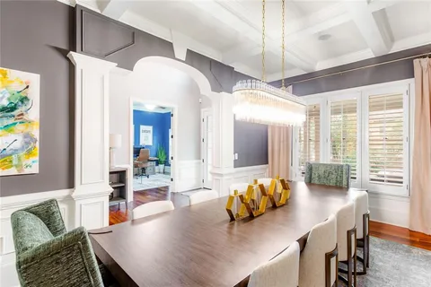 a view of a dining room with furniture and window