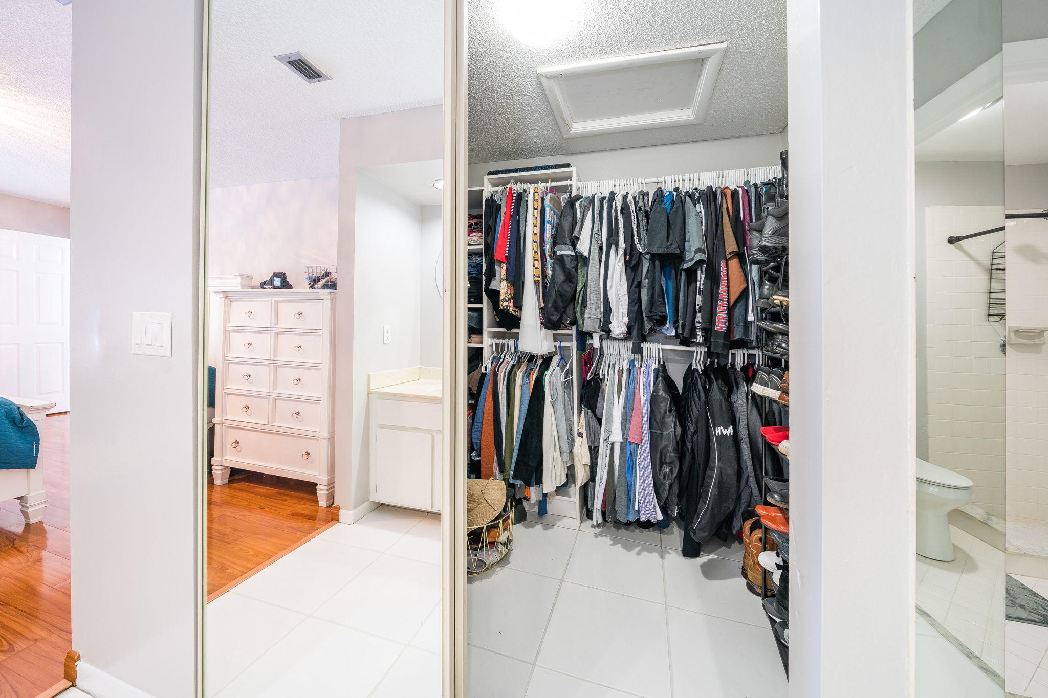 1877 Shower Tree Way Wellington, FL 33414 - Photo 14 of 47 a view of walk in closet with clothes and shoes