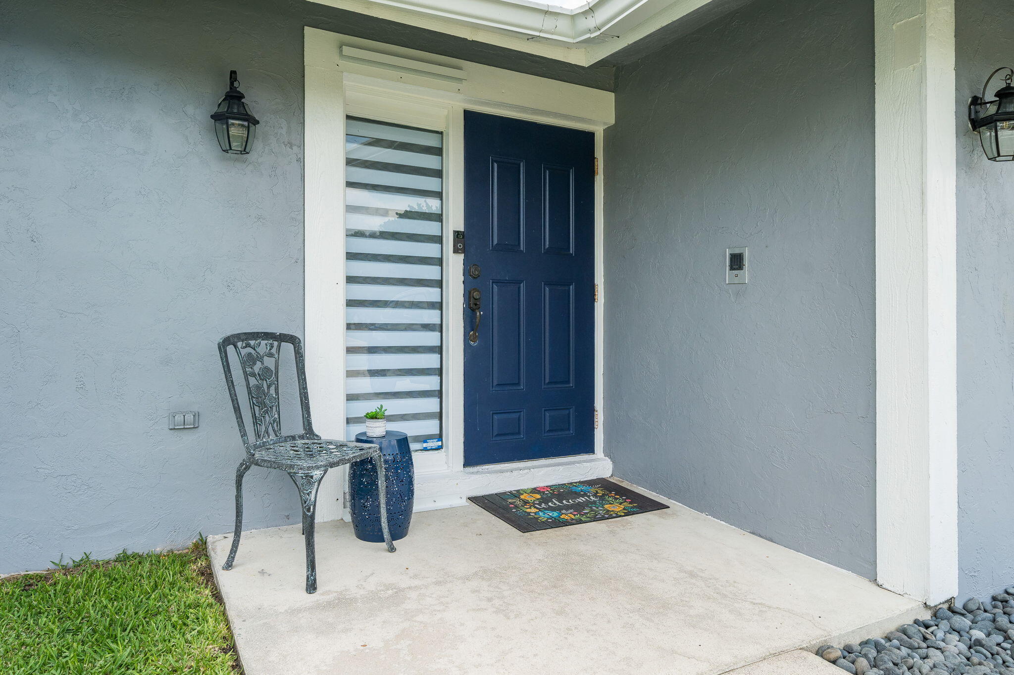 1877 Shower Tree Way Wellington, FL 33414 - Photo 3 of 47 a view of a hallway with seating area