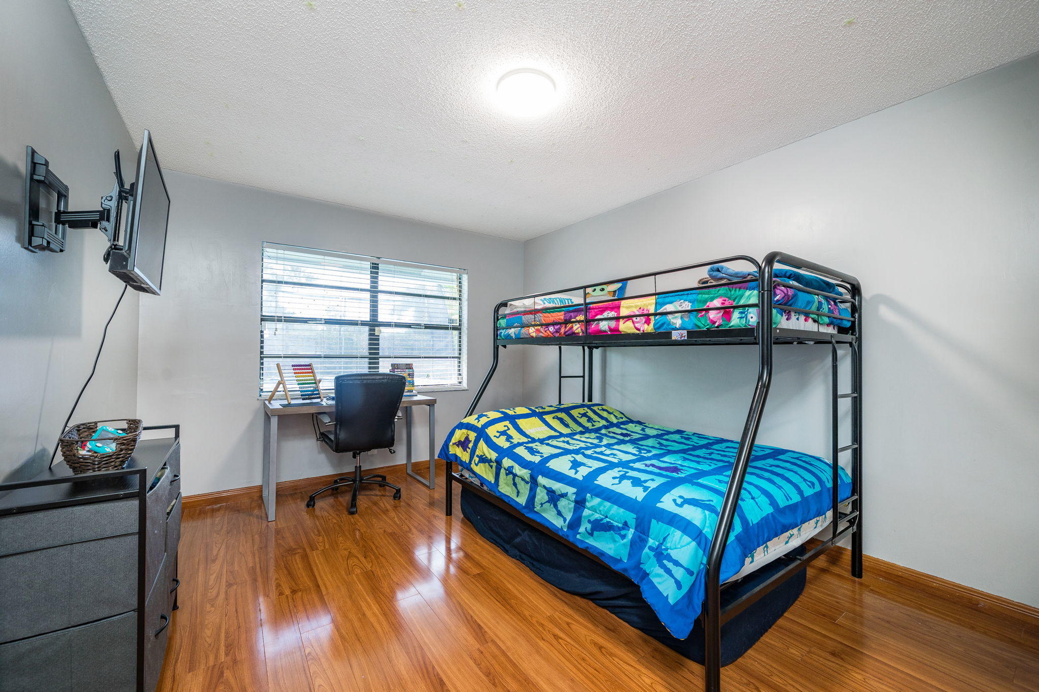 1877 Shower Tree Way Wellington, FL 33414 - Photo 31 of 47 a bedroom with a bed and wooden floor