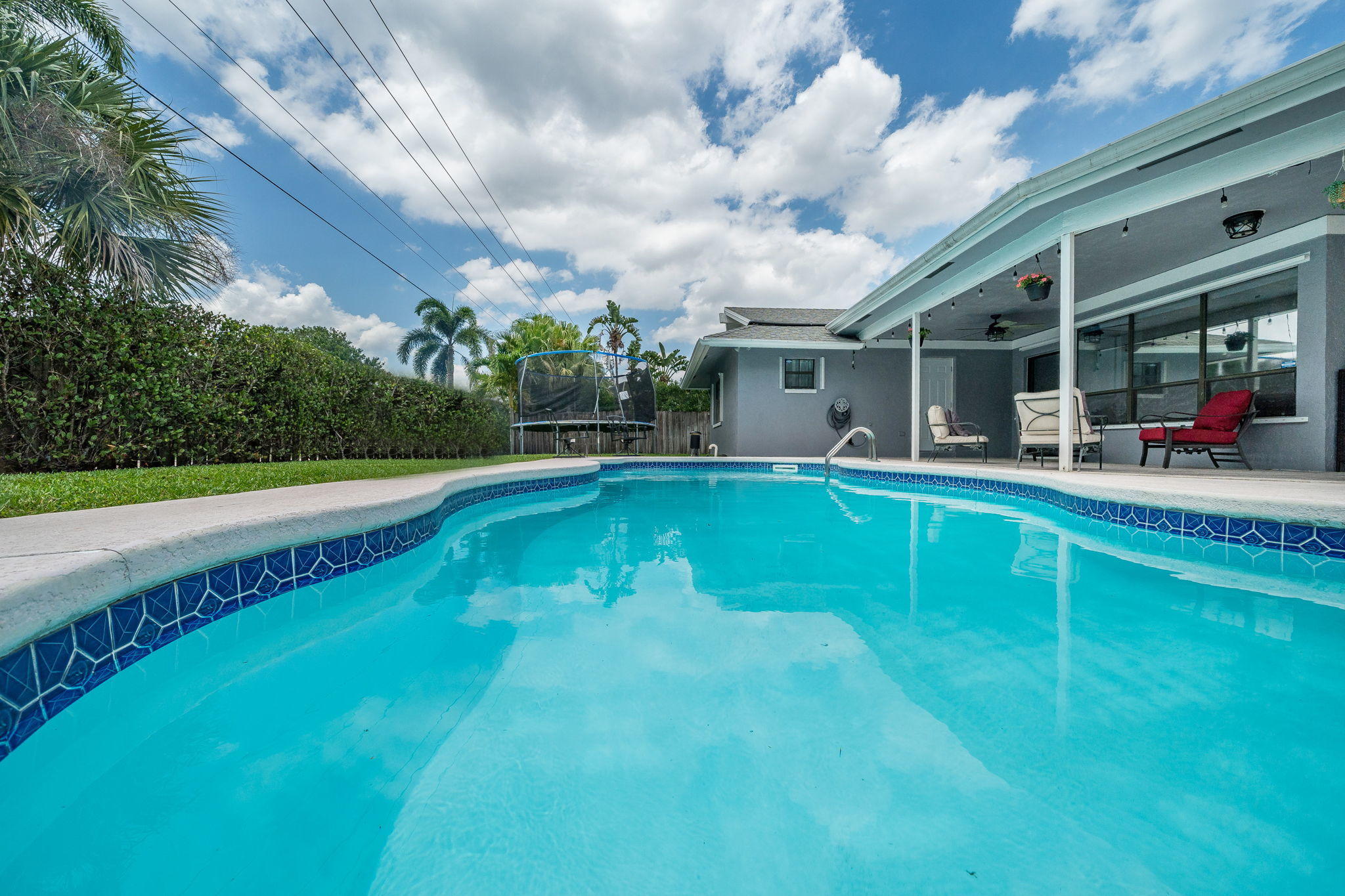 1877 Shower Tree Way Wellington, FL 33414 - Photo 38 of 47 a view of a house with a swimming pool