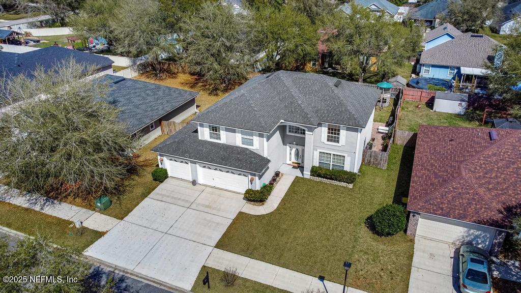 13694 Fish Eagle Drive West Jacksonville, FL 32226 - Photo 1 of 62 an aerial view of a house with yard swimming pool and outdoor seating