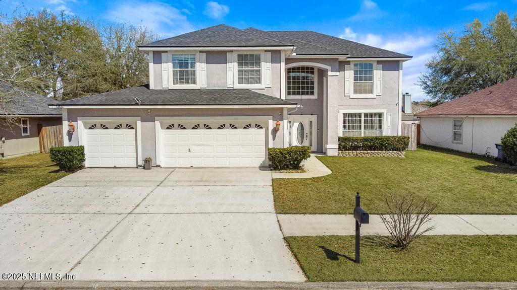 13694 Fish Eagle Drive West Jacksonville, FL 32226 - Photo 2 of 62 a view of a yard in front of a house