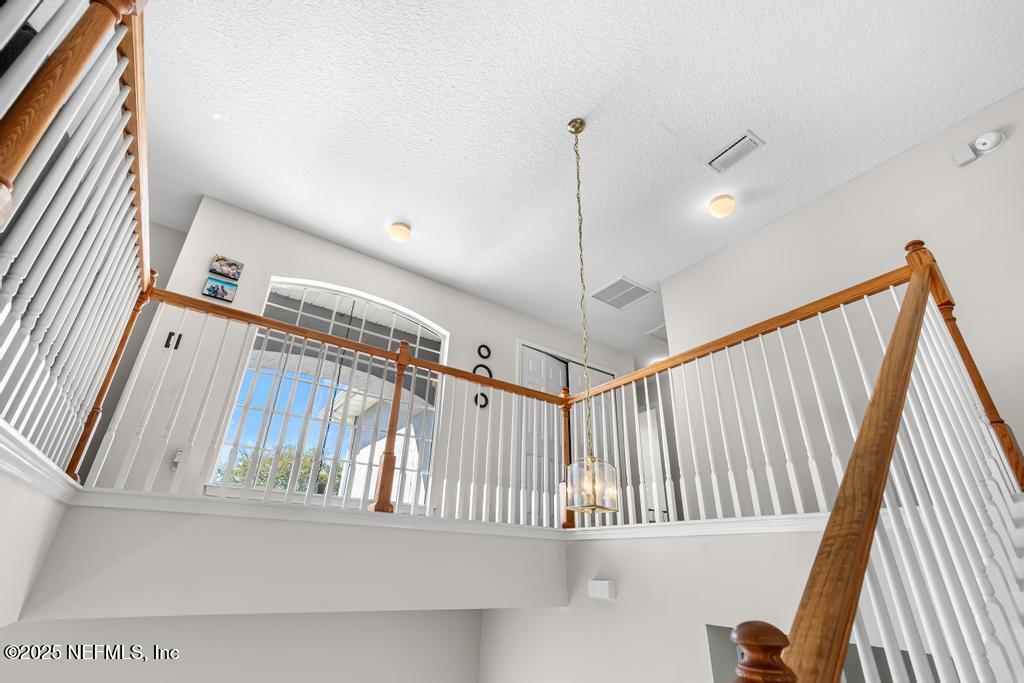 13694 Fish Eagle Drive West Jacksonville, FL 32226 - Photo 22 of 62 a view of a hallway with stairs