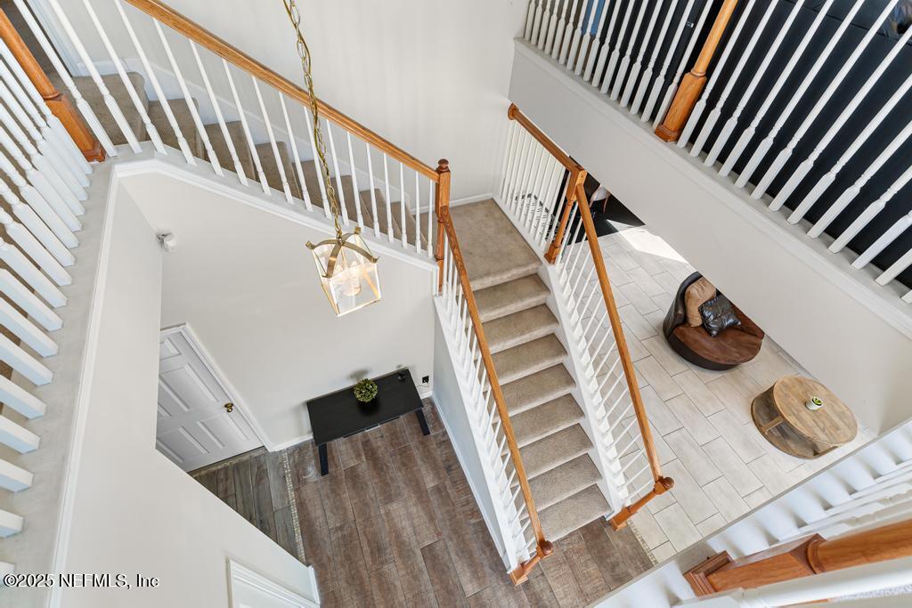 13694 Fish Eagle Drive West Jacksonville, FL 32226 - Photo 25 of 62 a view of entryway kitchen and hall with wooden floor