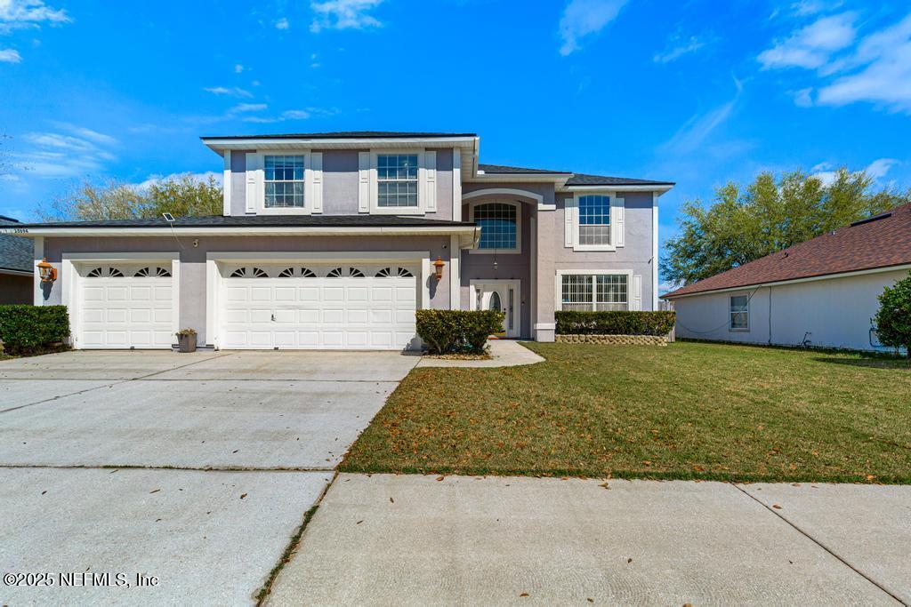 13694 Fish Eagle Drive West Jacksonville, FL 32226 - Photo 3 of 62 front view of a house with a yard