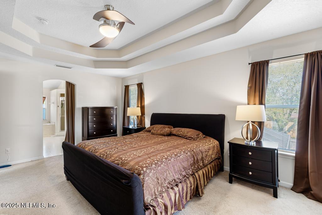 13694 Fish Eagle Drive West Jacksonville, FL 32226 - Photo 33 of 62 a bedroom with a bed and wooden floor