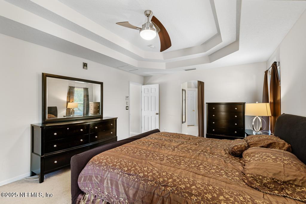 13694 Fish Eagle Drive West Jacksonville, FL 32226 - Photo 34 of 62 a bedroom with a bed and a dresser