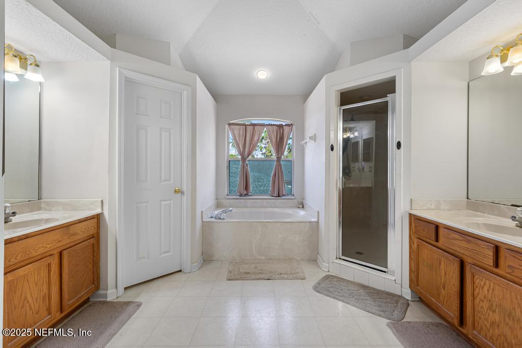 13694 Fish Eagle Drive West Jacksonville, FL 32226 - Photo 36 of 62 a bathroom with a sink and a mirror