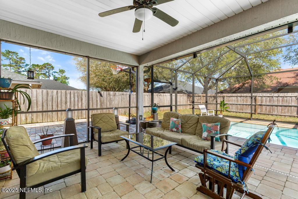13694 Fish Eagle Drive West Jacksonville, FL 32226 - Photo 40 of 62 a living room with furniture and a large window